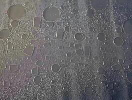 A close up of water droplets on a window photo
