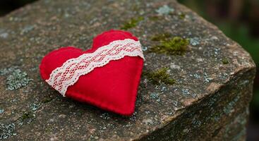A red heart on a rock photo