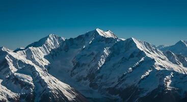 A large mountain range with snow on top photo