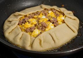 A pan with a doughy substance in it photo