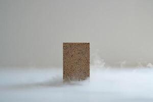 A block of wood with smoke coming out of it photo