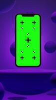 Vertical Animation of Smartphone with Green Chroma Key Screen on a Platform Surrounded by Balls with Purple Background video