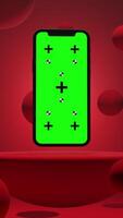 Vertical Animation of Smartphone with Green Chroma Key Screen on a Platform Surrounded by Balls with Red Background video