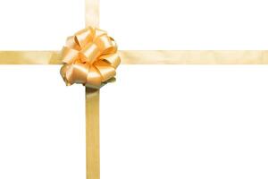 Gold ribbon bow isolated on white background. photo