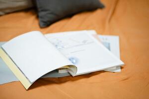 Top of blank book or magazine on sofa in mock up concept. photo