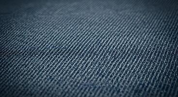 Detailed denim fabric texture in a close-up shot, ideal for background use in apparel design, advertising, or digital branding. photo