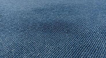 Close-up denim fabric texture in sharp detail, ideal for apparel ads, fashion portfolios, or digital craft projects. photo