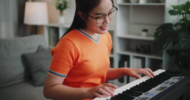 Handheld shot, A determined young woman is practicing her keyboard alone and enjoys a peaceful moment with music. video