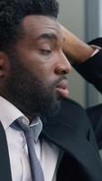 Close up stressed anxiety worried depressed African American business man thinking problem solution looking at window in office trouble pondering difficult decision businessman male working stress video