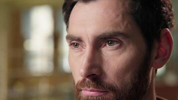 Thoughtful man Caucasian businessman close up pensive male portrait serious thinking consider business employer worker indoors think middle-aged guy green eyes close up looking health vision eyesight video