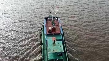 Tugboat moving through the river video