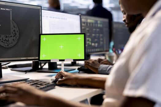 Software developer in server hub ensuring data remains shielded from potential threats using mockup tablet. Close up of worker safeguarding data center against hackers with isolated screen device photo