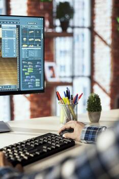 Interior designer in home office using 3D modeling software for client commission, choosing furniture units, rotating objects, modifying apartment rooms layout for customers, close up shot photo