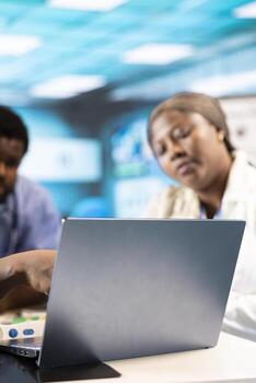 Medical expert explaining scans to team of nurses interns in the office, combining advanced technology tools with their expertise and knowledge. Teamwork for great healthcare services. photo