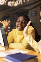 Primary school pupils in a library discuss during an online seminar, using technology to connect with their educator and classmates for an interactive virtual chat. Remote lesson via web conference. photo
