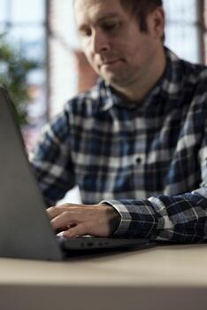 Employee analyzing data charts on notebook, interpreting statistical graphs, identifying trends. Close up of man compiling analytical reports, using data analysis software to process information photo