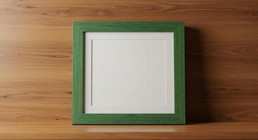Green frame on wooden table with white background photo