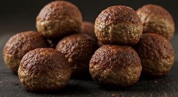 A pile of meatballs on a table photo
