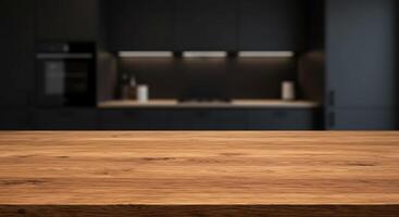 A wooden table in front of a black kitchen photo