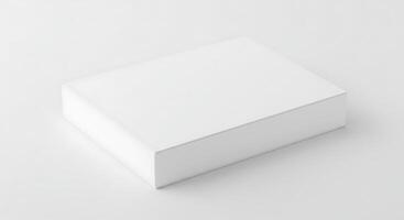 A white box sitting on a table with a blank surface photo