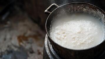 Rustic Pot Simmering White Liquid Emitting Soft Steam. photo