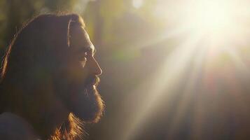 Man's Profile Gazing Towards Bright Light Amidst Nature's Glow. photo