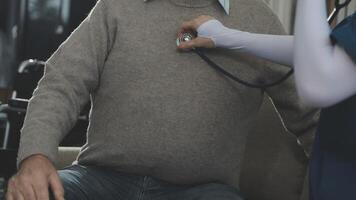 A man is sitting on a couch with a stethoscope video