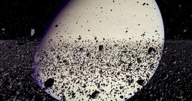 CGI The image depicts Saturn and its iconic rings, surrounded by rocky debris in a space environment video