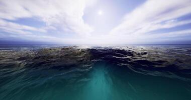 Surreal CGI blue ocean meets the horizon under a clear sky. video