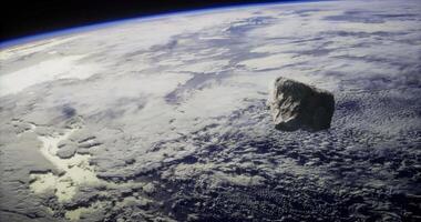 CGI of an asteroid in space, with Earth in the background video