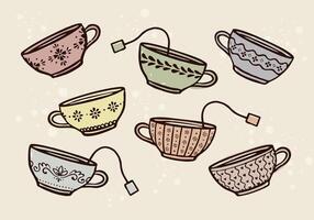 Hand-drawn vintage style tea cups. Trendy ornamental teacup illustration set with tea bags. Charming, cozy, cottagecore tea drawing for packaging, branding, and invitations. Isolated elements. vector