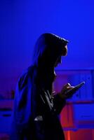 Hacker using smartphone for phishing attack and data theft photo