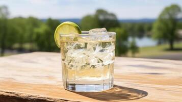 Refreshing cocktail with lime on a wooden table. photo