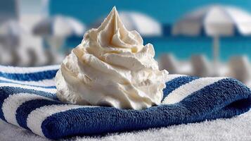 Whipped cream on a towel, sunny beach day. photo