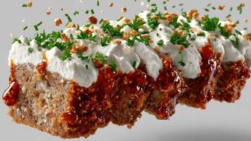 Close-up of a meatloaf section with sauce and herbs. photo