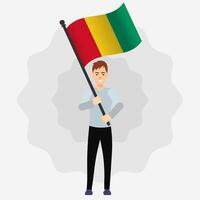 Happy Man Holding Guinea Flag vector