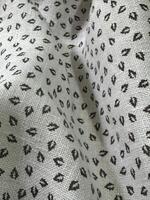 Light grey fabric with black leaf pattern textile photo