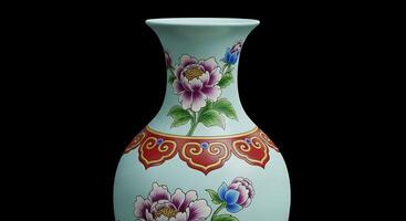A vase with a flower design on the side photo