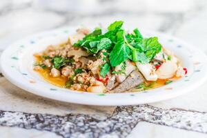 A plate of food with meat and vegetables on it photo