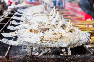 A grill with a bunch of meat on it photo
