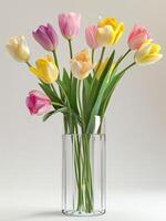 A vase filled with colorful tulips on a table photo