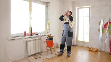 A man standing in front of a window in a room video