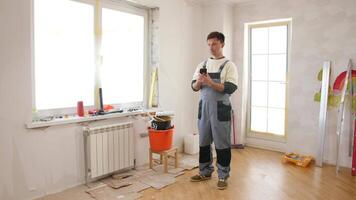 A man standing in a room with a toolbox video