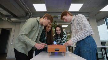 Students playing a tabletop game together in classroom video