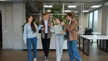 Students having fun playing charades in university hallway video