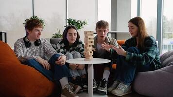 Students playing jenga, a test of nerves and precision video