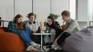 Students playing jenga, having fun and enjoying their time together video