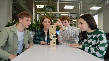 Students playing jenga, building, balancing, and bonding video