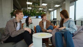 Students playing guessing game with sticky notes on foreheads video