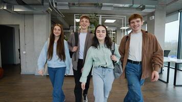 Students walking together in university hallway video